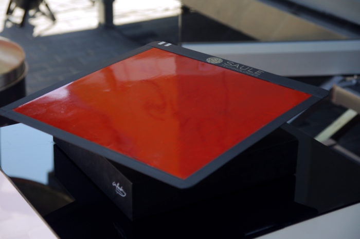 Red perovskite module levitating on a magnetic stand